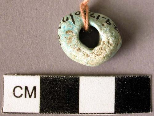 Green faience bead