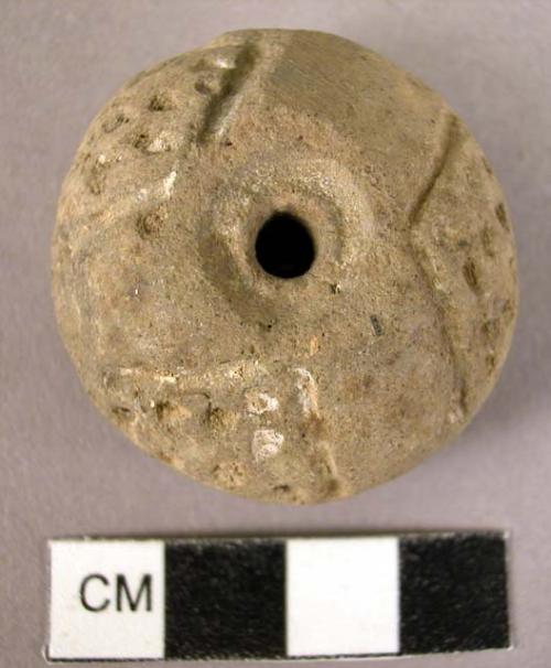 Pottery spindle whorl with puntate designs