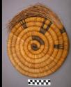 Bundle coiled basket plaque (po:ta). Design representing abstract kachina.