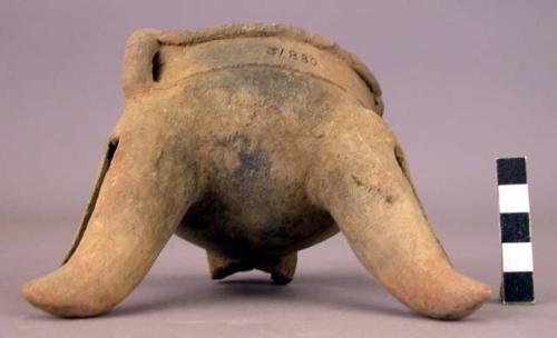 Pottery dish, tripod, legs hollow with clay balls