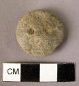 Pottery disc with 2 perforations (like a button)