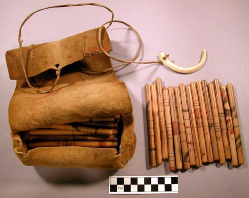 Leather pouch and 38 gambling sticks