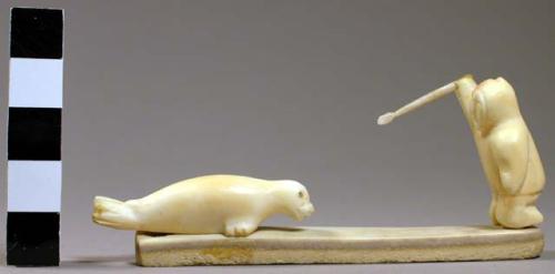 Ivory carving - man on his knees ready to spear a seal