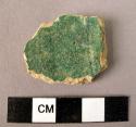 Ceramic body sherd, green irridescent glaze