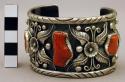 Cuff bracelet, oxidized silver band with floral motifs, inlaid coral stones