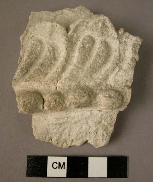 Fragment of plaster decoration (lotus leaf?)