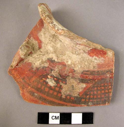 Potsherd - black on red slip