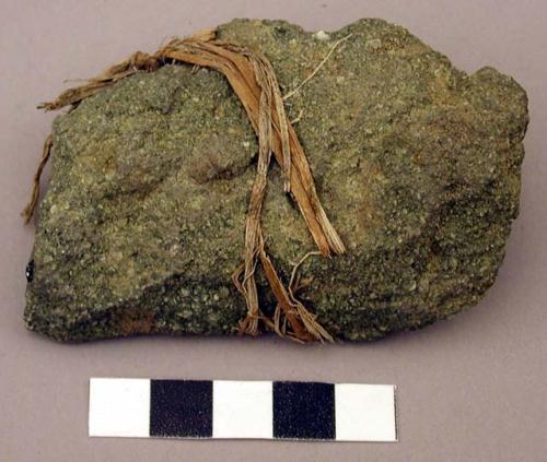 Raw material, unmodified rock tied with twine