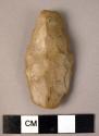 Bifacially flaked leaf-shaped flint point of Sbaikian type; heavily rolled;