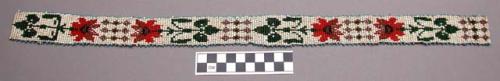 Headband of beadwork - red flowers with green leaves on white background