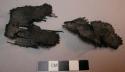 Fragments of charred cloth (sandal?)