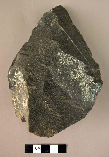 Quartzite fist axe - plano-convex in section, with a triangular point