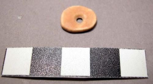 Irregular disc bead of ostrich shell