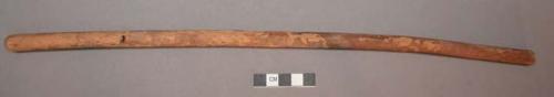 Worked stick. Found with hank of feather cloth string, A1280.