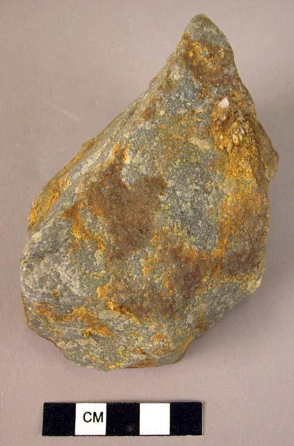 Small quartzite crude fist axe - made on on a coarse flake, apparently unfinishe