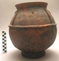 Clay pot with incised and applique decoration