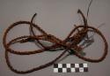 Cords; veg. fiber; twisted cordage; one of ends knotted; some ends frayed