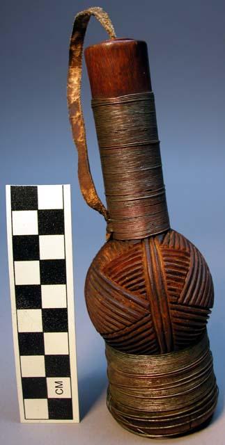 Carved wooden snuff box with leather stopper and wire around base and neck  Inte