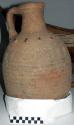 Pottery water jar - incised decoration on exterior, also colored +