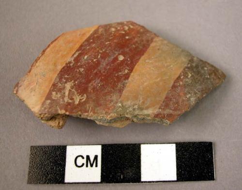 Potsherd - burnished with broad red painted stripes on yellow background