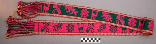 Woven wool belt, source unknown. reversible design in pink and green. 8 x 146 cm