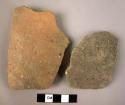 Ceramic body sherds, 1 undecorated brown slip, 1 coarse ware