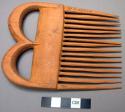 Wooden comb - used for combing and dressing hair, never worn