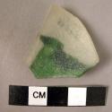 Piece of white glass with aplied layer of moss-green glass (either small cup or
