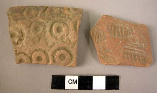 2 potsherds - red, stamped