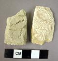 2 potsherds with incised decoration