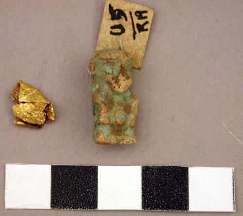 Small Ptah (?) amulet of poor thin bl-gr faience, with two holes for stringing