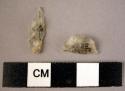 Small quartz microlithic lunate; quartz microlithic point