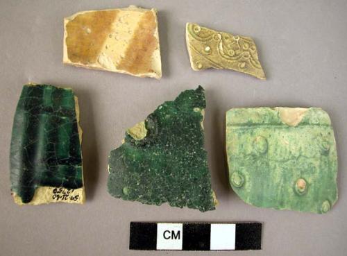 Potsherds (5); glazed; 4 greenish, 1 brown and buff, 1 with excised exterior.
