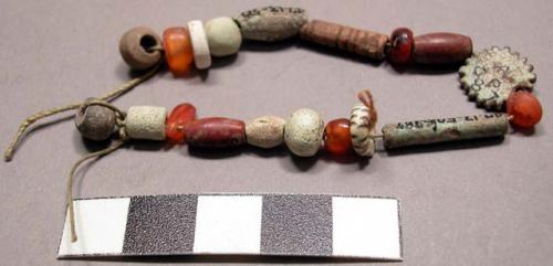 String of beads, faince, camelian, pottery, jasper