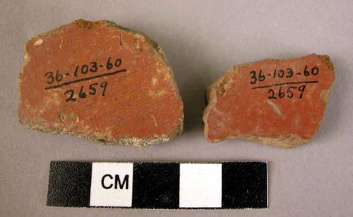 2 potsherds - red wash, burnish; coarse, medium fire, red-brown paste; wheelmade