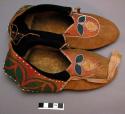 Pair of woman's leather moccasins - decorated with silk and beads