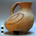 Modern ceramic pitcher. Red earthenware, bird-shaped body, loop handle