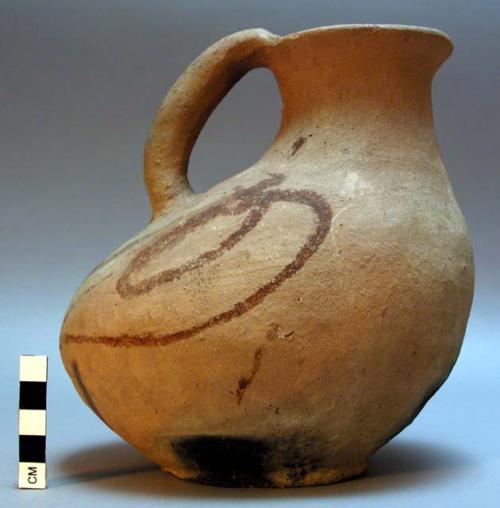 Modern ceramic pitcher. Red earthenware, bird-shaped body, loop handle