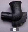 Black clay pipe bowl with crest along elbow and incised ornamentation