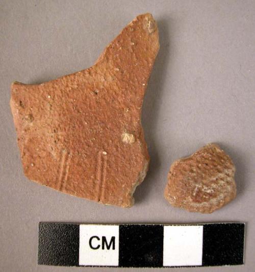 2 potsherds - 1 imrpessed, 1 incised