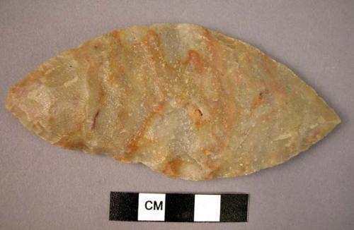 Chipped stone edged tool, biface, leaf-shaped, grey with red streaks