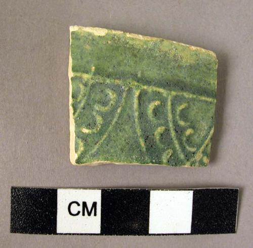 Potsherd - green glaze rim; Samarra molded pottery