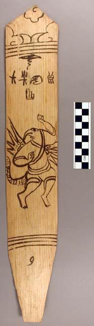 Ornament?, flat stick, black painted designs - zoomorph/human with wings