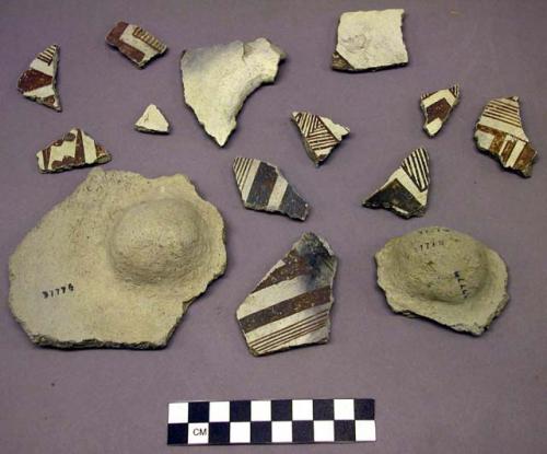 Ceramic; sherd - body; brown on white ext.; 2 sherds w/indentat'ns from ext.