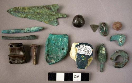 Metal artifacts and fragments; iron nails; coin.