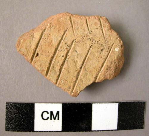 1 pre-Halaf ware sherd, probably Hassuna Standard incised ware