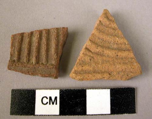 2 potsherds - red, moulded(?) relief