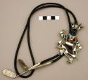 Bolo, silver base in the form of a katsina guard dancer inlaid w/stones & shell