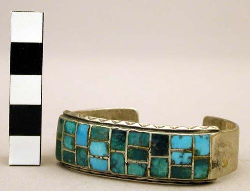 Cuff bracelet inlaid w/turquoise squares, stamped design along borders