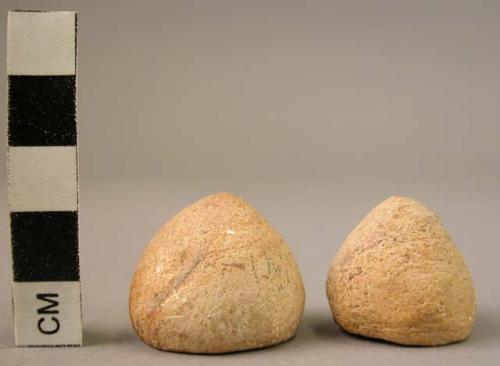 Ceramic or plaster objects, pyramidal (rounded), orange ware